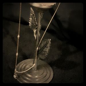 Petite silver mother of pearl pendant on a 14" ch